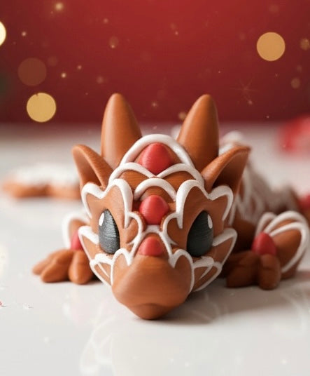 Gingerbread dragon decoration on a white surface with a blurred red background